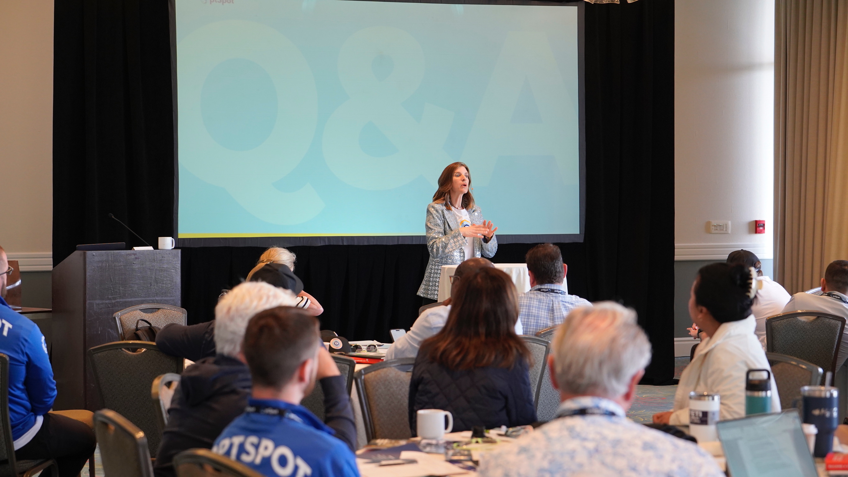 Presenter leading a session at the OptSpot Summit